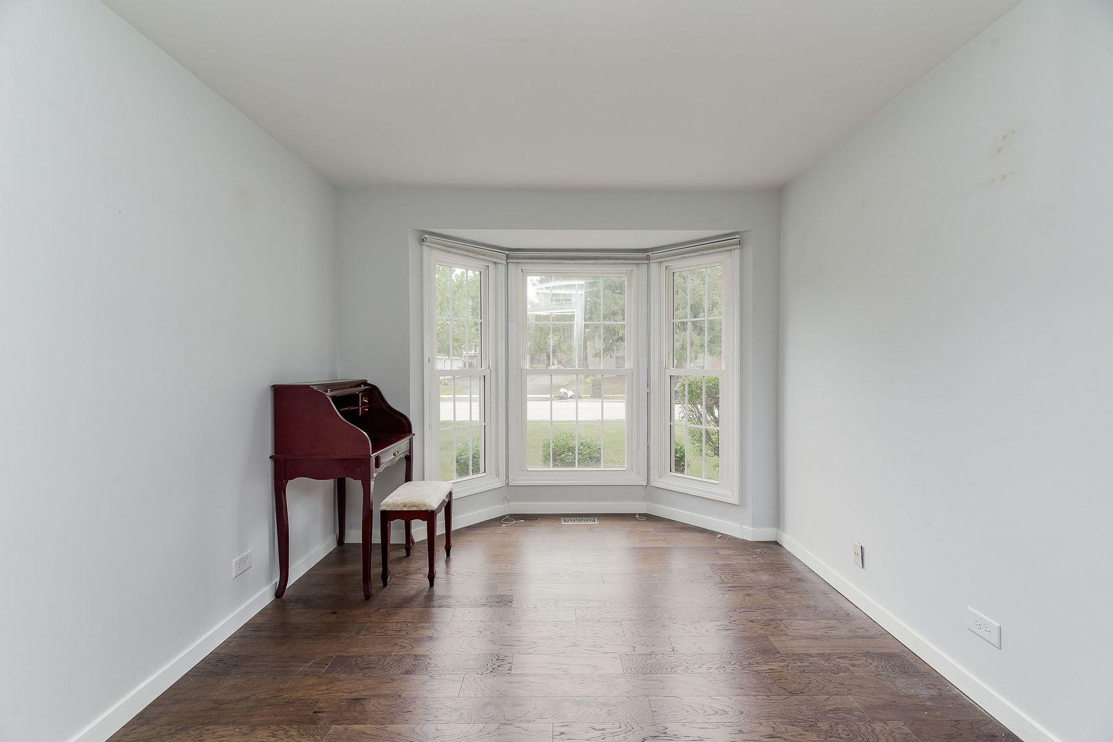 1122 Spring Garden Circle, Unit 2 Naperville, IL 60563 - Photo 7 of 10 a view of room with window and wooden floor