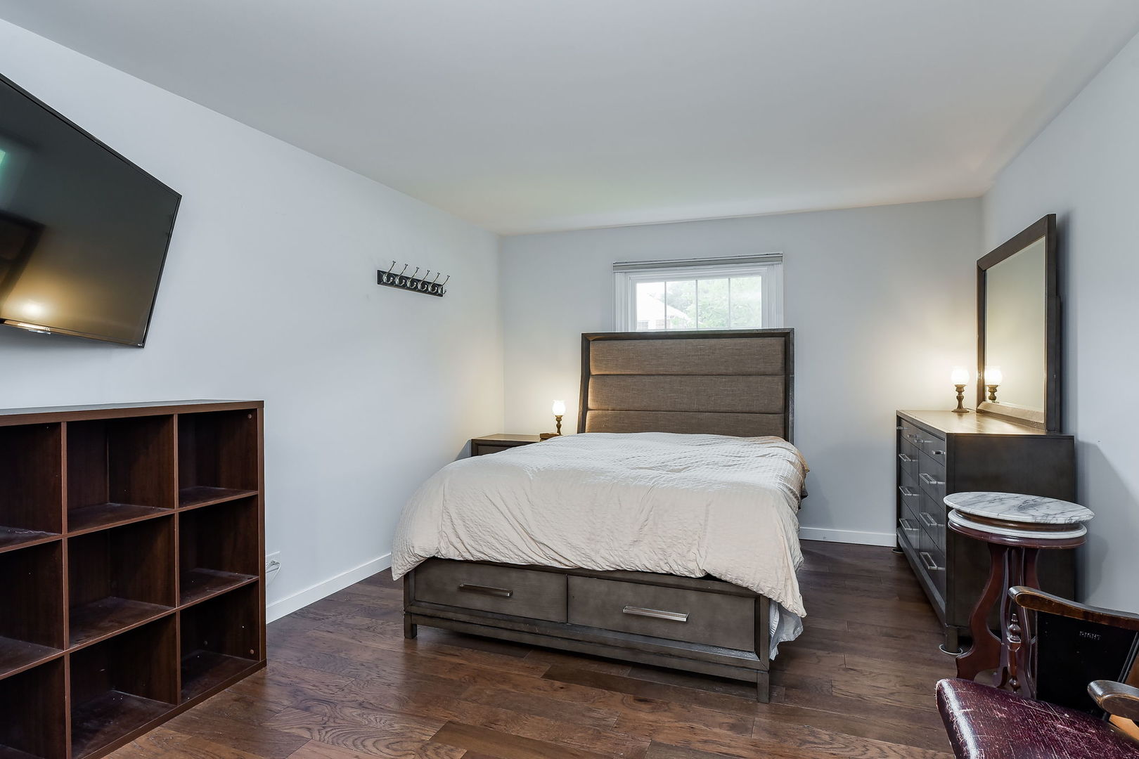 1122 Spring Garden Circle, Unit 2 Naperville, IL 60563 - Photo 9 of 10 a bedroom with a bed and a flat screen tv