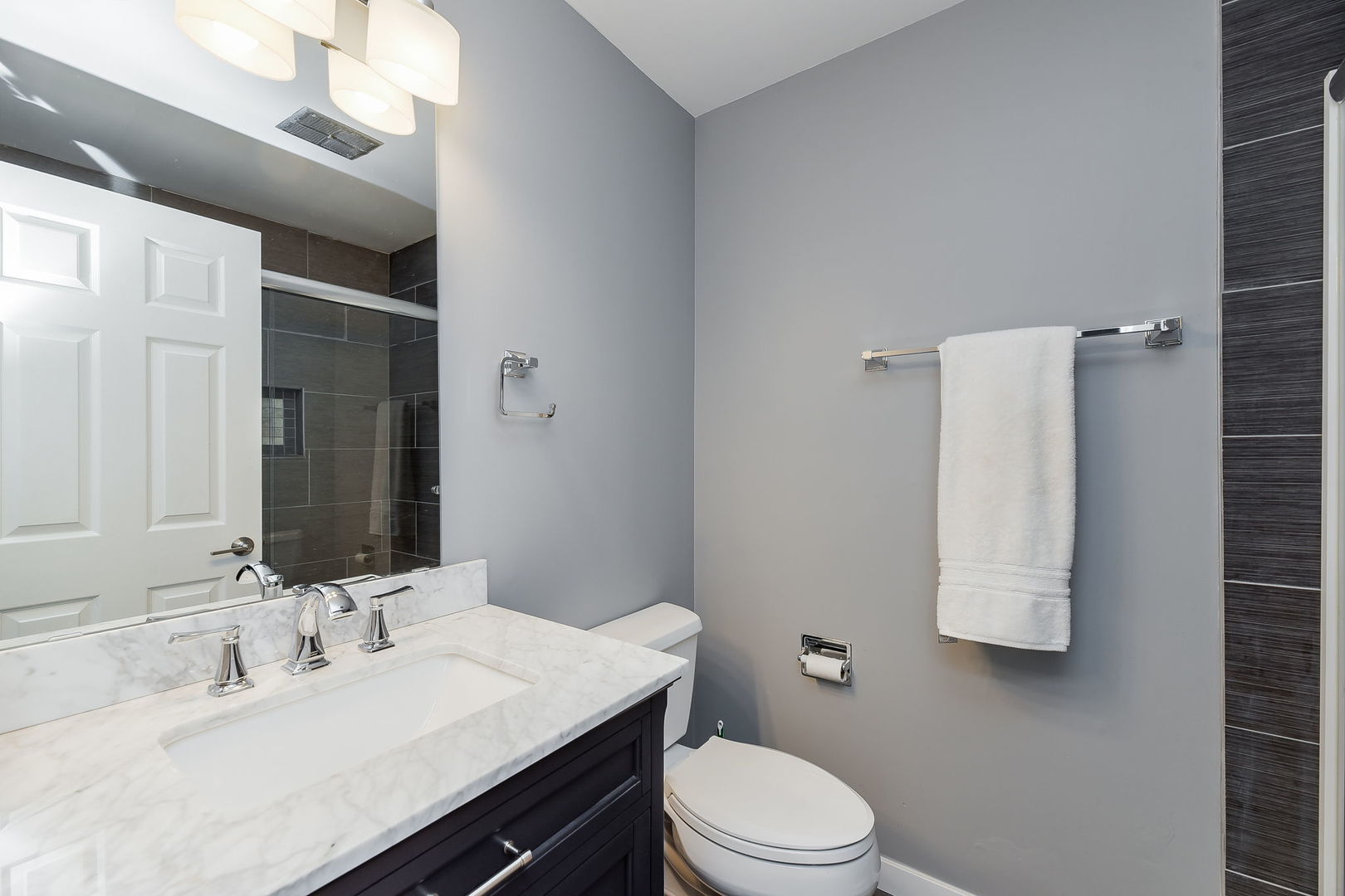 1122 Spring Garden Circle, Unit 2 Naperville, IL 60563 - Photo 10 of 10 a bathroom with a sink vanity mirror and toilet