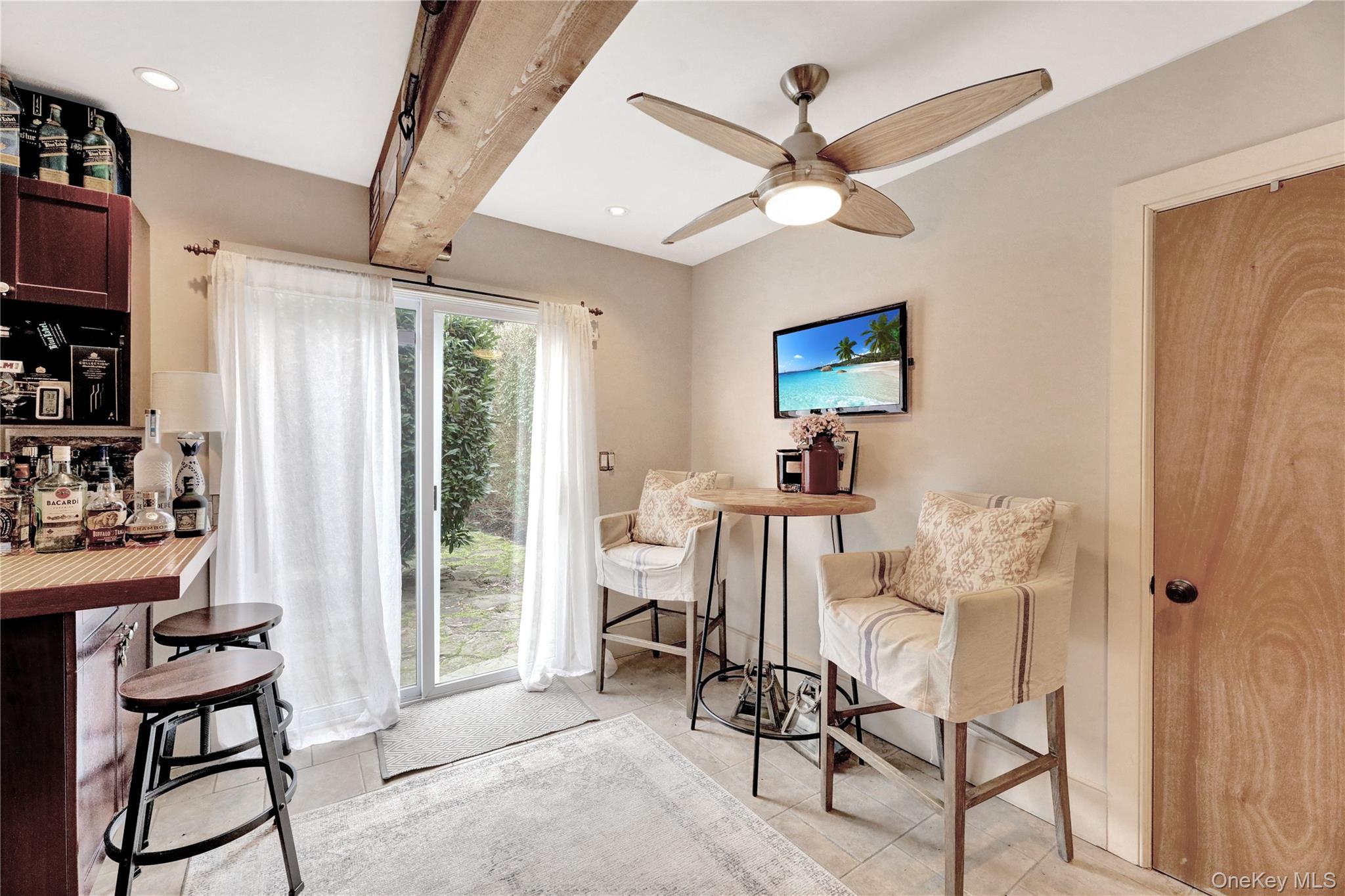 198 South Country Road Remsenburg, NY 11960 - Photo 39 of 49 a view of a livingroom with furniture and a ceiling fan