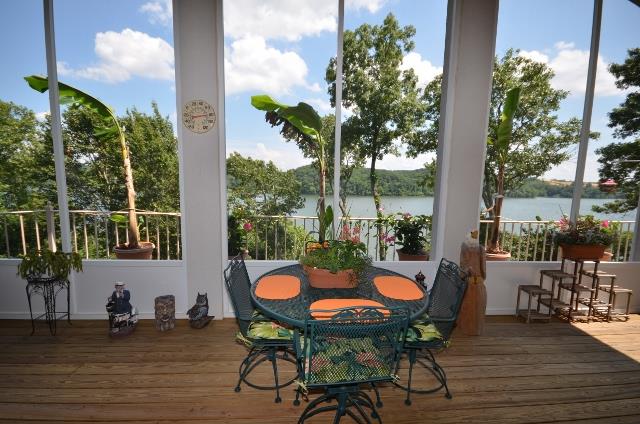 328 River Trace Road Dover, TN 37058 - Photo 14 of 30 a table that has some chairs on it and wooden floor