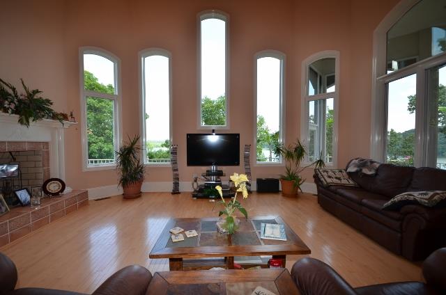 328 River Trace Road Dover, TN 37058 - Photo 5 of 30 a living room with furniture fireplace and a large window