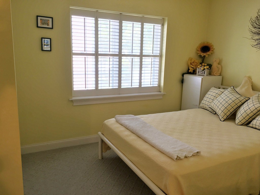 198 Lake Shore Road, Unit 2 Boston, MA 02135 - Photo 14 of 17 a bedroom with a bed and window