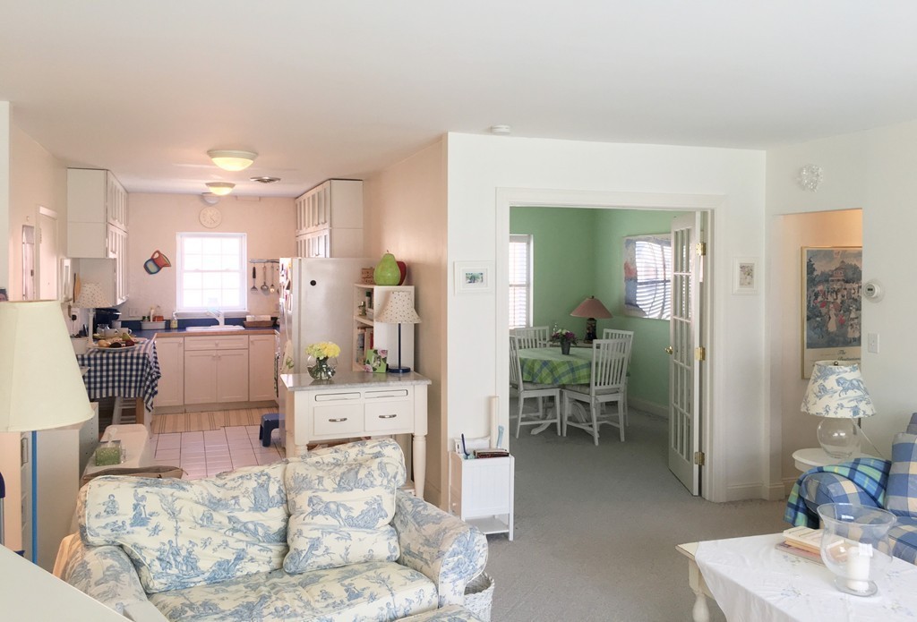 198 Lake Shore Road, Unit 2 Boston, MA 02135 - Photo 5 of 17 a living room with furniture and a dining table
