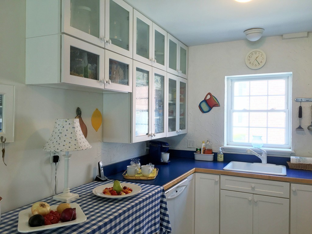 198 Lake Shore Road, Unit 2 Boston, MA 02135 - Photo 8 of 17 a kitchen with a sink and a stove