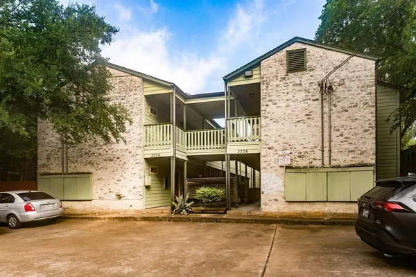 a front view of a house with parking space