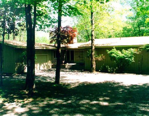 111 Peaceable Hill Road Ridgefield, CT 06877 - Photo 1 of 1 a backyard of a house with lots of green space