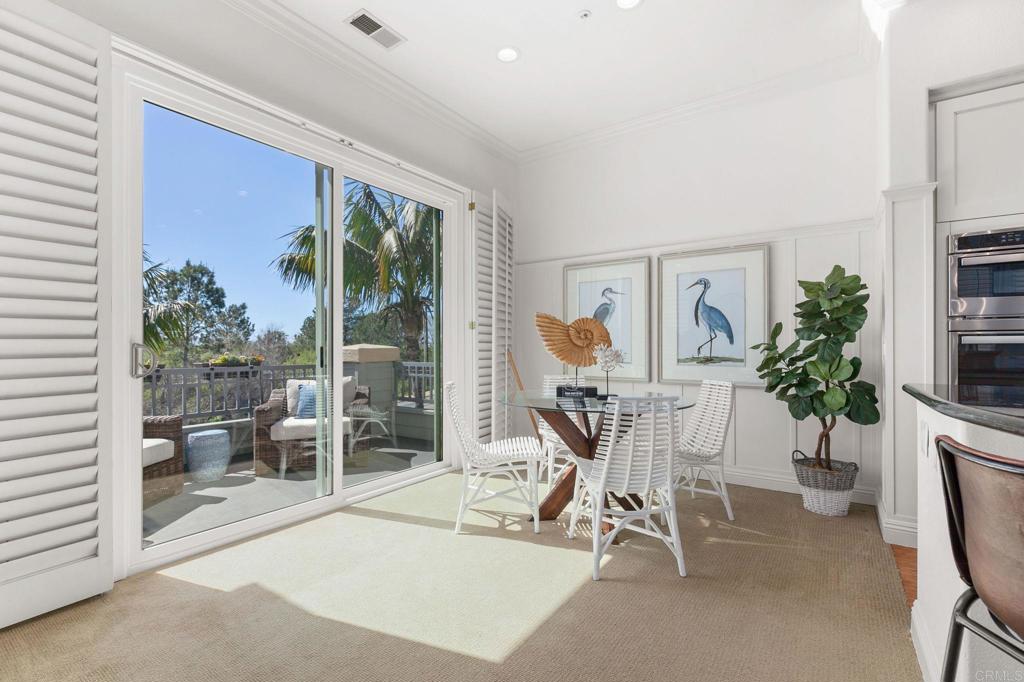 2738 MacKinnon Ranch Road Cardiff-by-the-Sea, CA 92007 - Photo 11 of 58 a room with furniture a potted plant and a large window