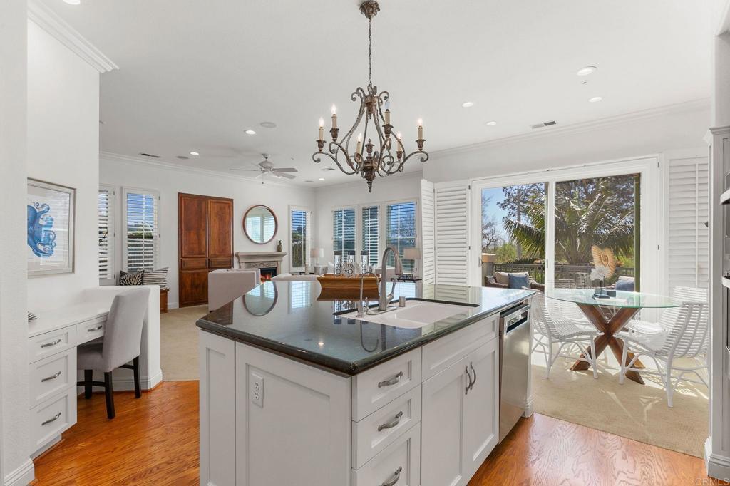 2738 MacKinnon Ranch Road Cardiff-by-the-Sea, CA 92007 - Photo 16 of 58 a view of center island of a kitchen with granite countertop living room and living room