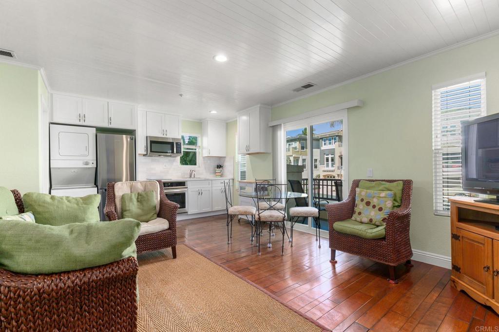 2738 MacKinnon Ranch Road Cardiff-by-the-Sea, CA 92007 - Photo 18 of 58 a living room with furniture and wooden floor