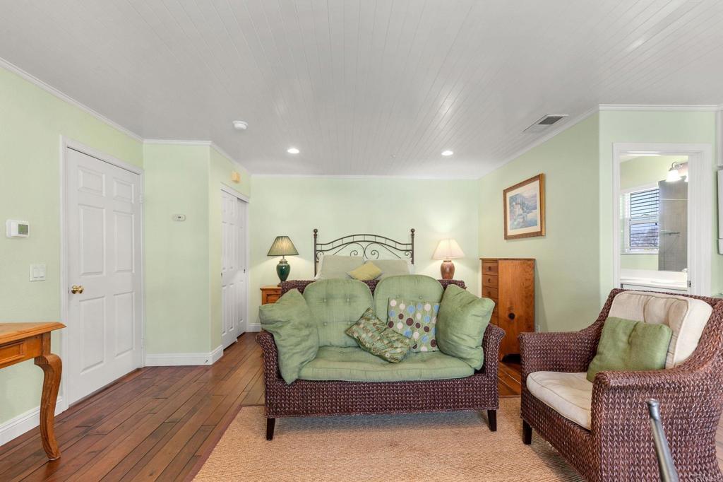 2738 MacKinnon Ranch Road Cardiff-by-the-Sea, CA 92007 - Photo 21 of 58 a living room with furniture and a couch