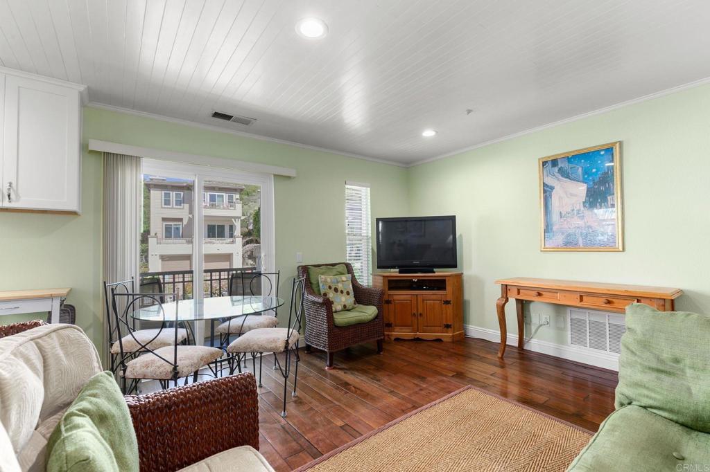 2738 MacKinnon Ranch Road Cardiff-by-the-Sea, CA 92007 - Photo 22 of 58 a living room with furniture and a flat screen tv