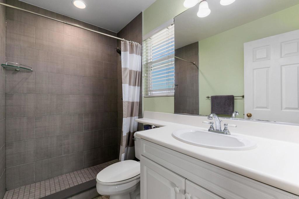 2738 MacKinnon Ranch Road Cardiff-by-the-Sea, CA 92007 - Photo 24 of 58 a bathroom with a sink toilet and shower
