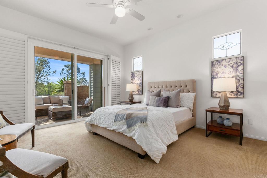 2738 MacKinnon Ranch Road Cardiff-by-the-Sea, CA 92007 - Photo 25 of 58 a bedroom with a bed and a couch