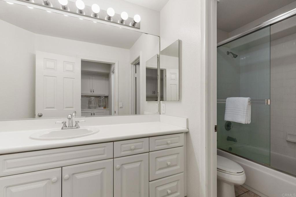 2738 MacKinnon Ranch Road Cardiff-by-the-Sea, CA 92007 - Photo 36 of 58 a bathroom with a sink a toilet and shower