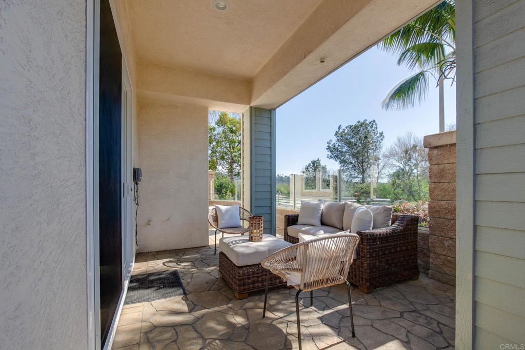 2738 MacKinnon Ranch Road Cardiff-by-the-Sea, CA 92007 - Photo 38 of 58 a patio with patio couch and table