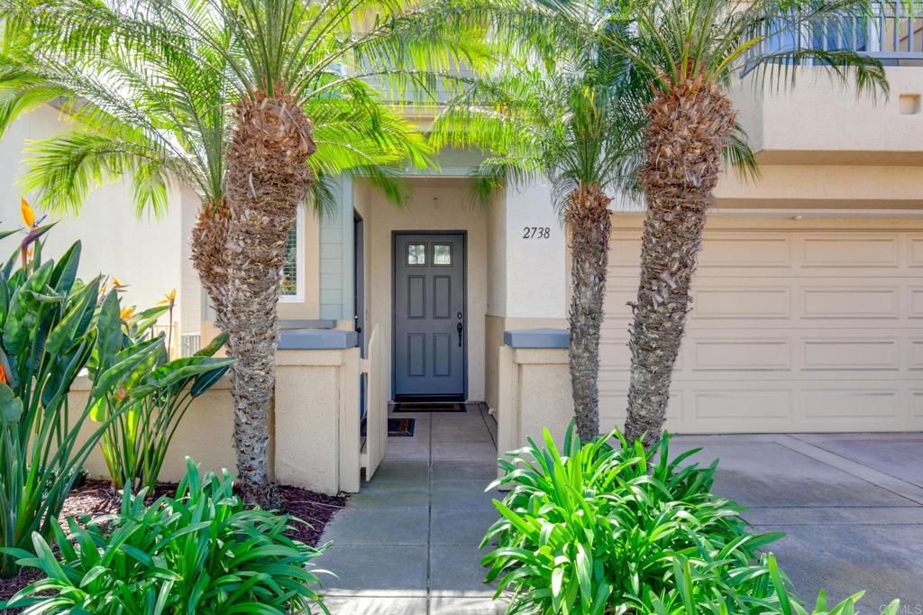 2738 MacKinnon Ranch Road Cardiff-by-the-Sea, CA 92007 - Photo 4 of 58 a house with a tree in front of it