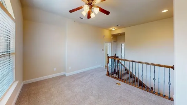 a view of a hallway with a chandelier