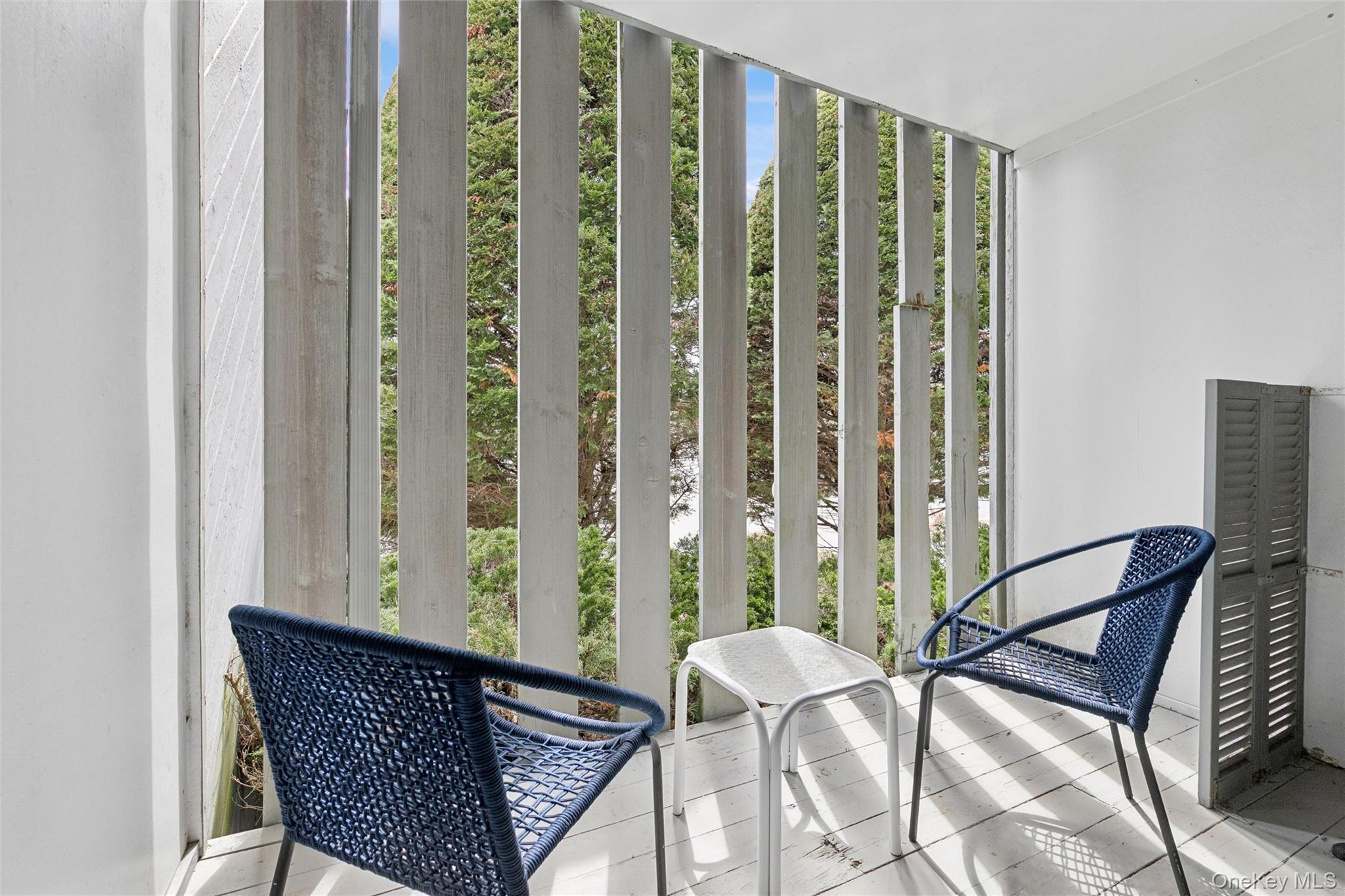 274 Dune Road, Unit 9 Westhampton Beach, NY 11978 - Photo 9 of 13 a view of a balcony with chairs