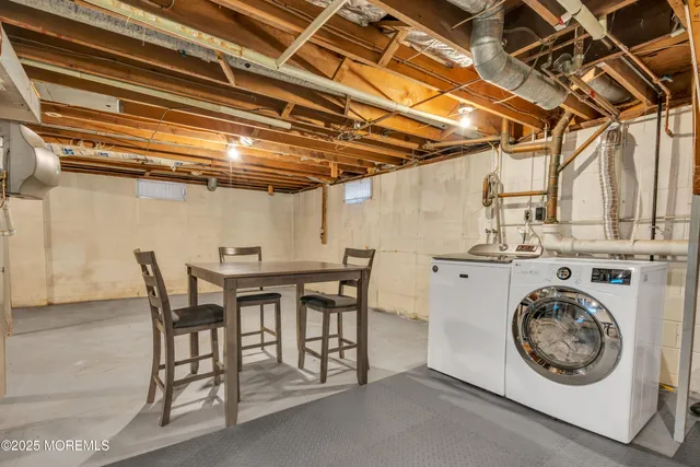 a view of a kitchen with a table and chairs