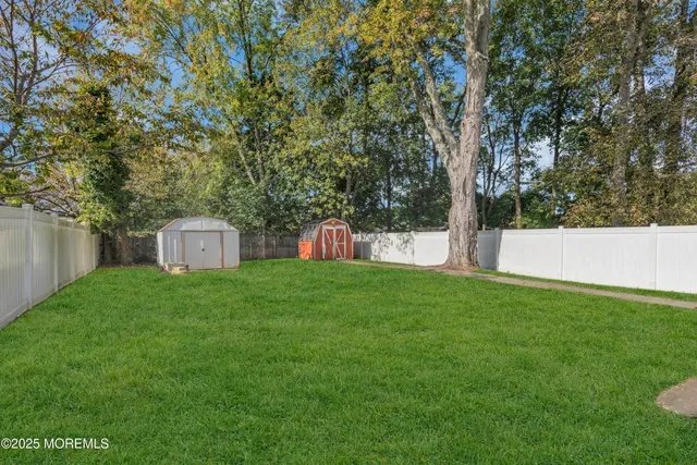 a view of a tiny house with a yard