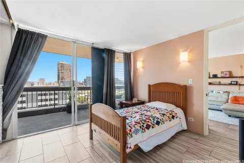 a bedroom with a bed and glass window