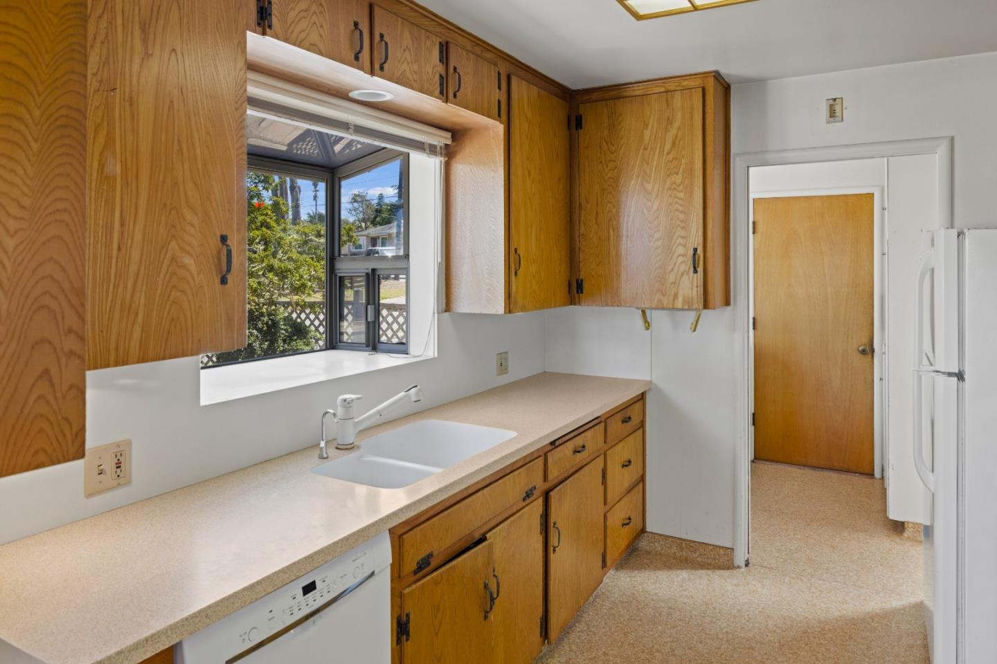30 Acropolis Street Pacific Grove, CA 93950 - Photo 11 of 36 a utility room with cabinets washer and dryer