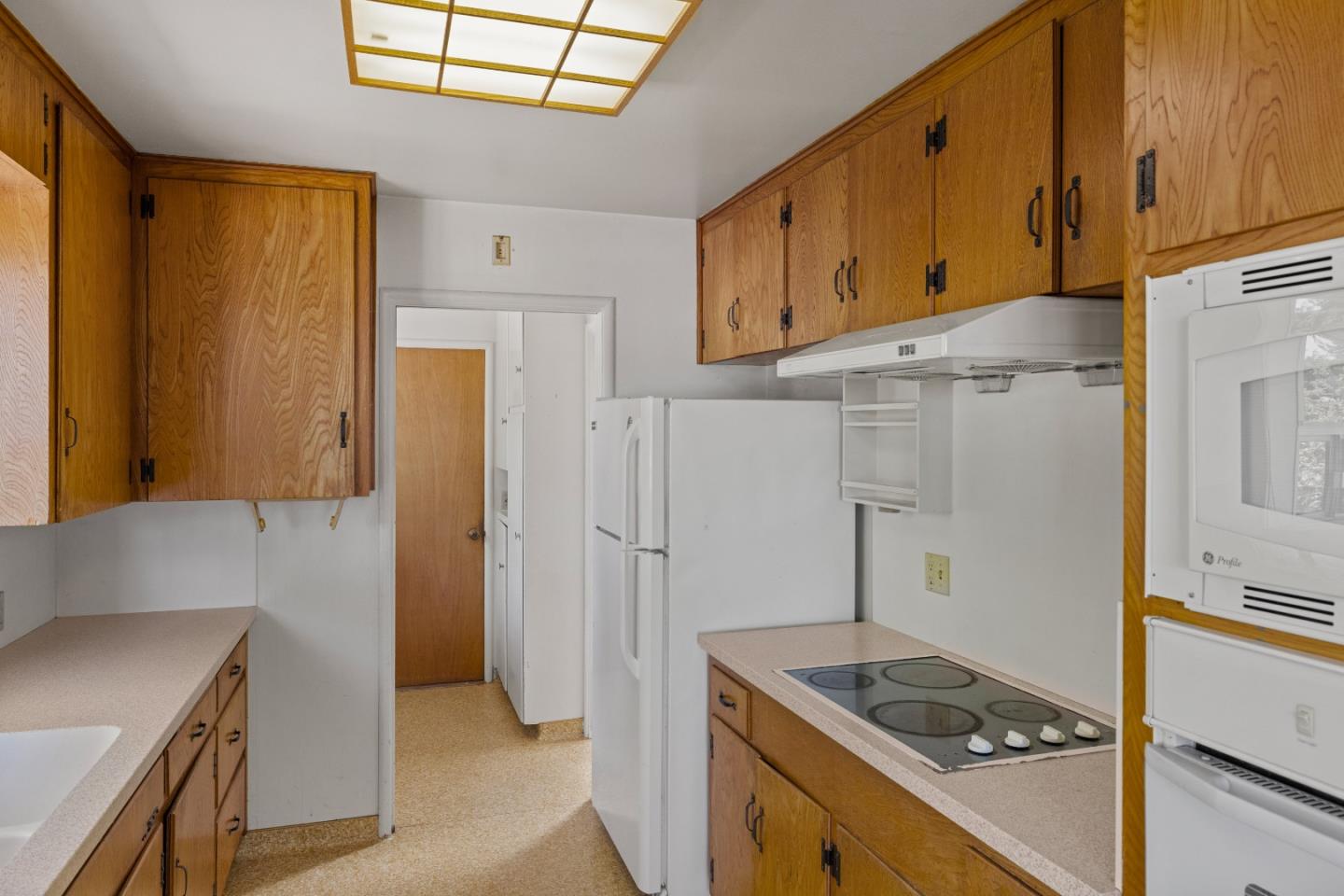 30 Acropolis Street Pacific Grove, CA 93950 - Photo 12 of 36 a kitchen with stainless steel appliances granite countertop a refrigerator and a stove