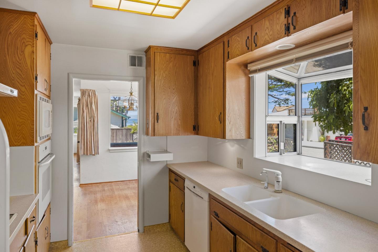 30 Acropolis Street Pacific Grove, CA 93950 - Photo 13 of 36 a en suite bathroom with a granite countertop sink and a mirror