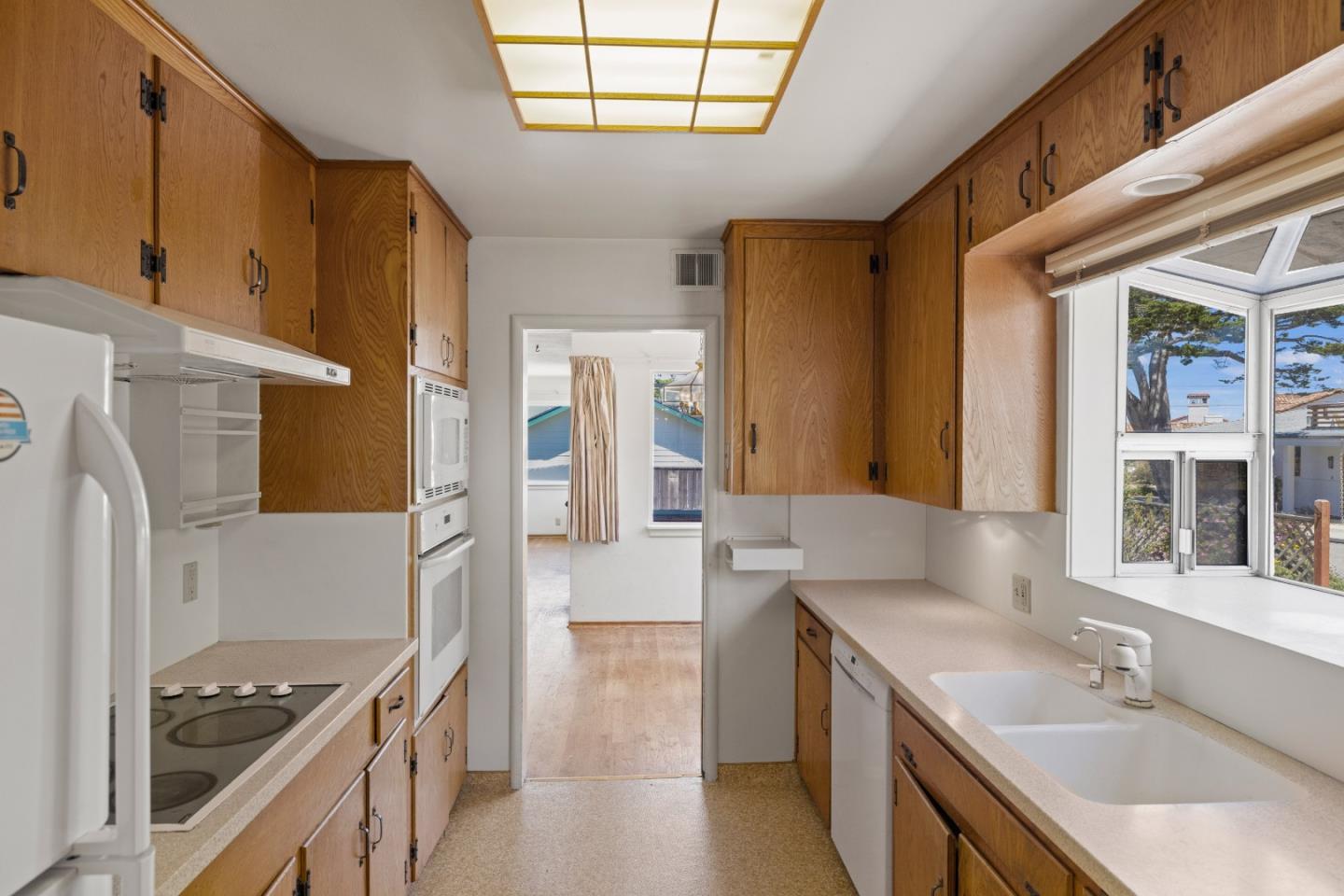 30 Acropolis Street Pacific Grove, CA 93950 - Photo 14 of 36 a kitchen with a sink stove and refrigerator