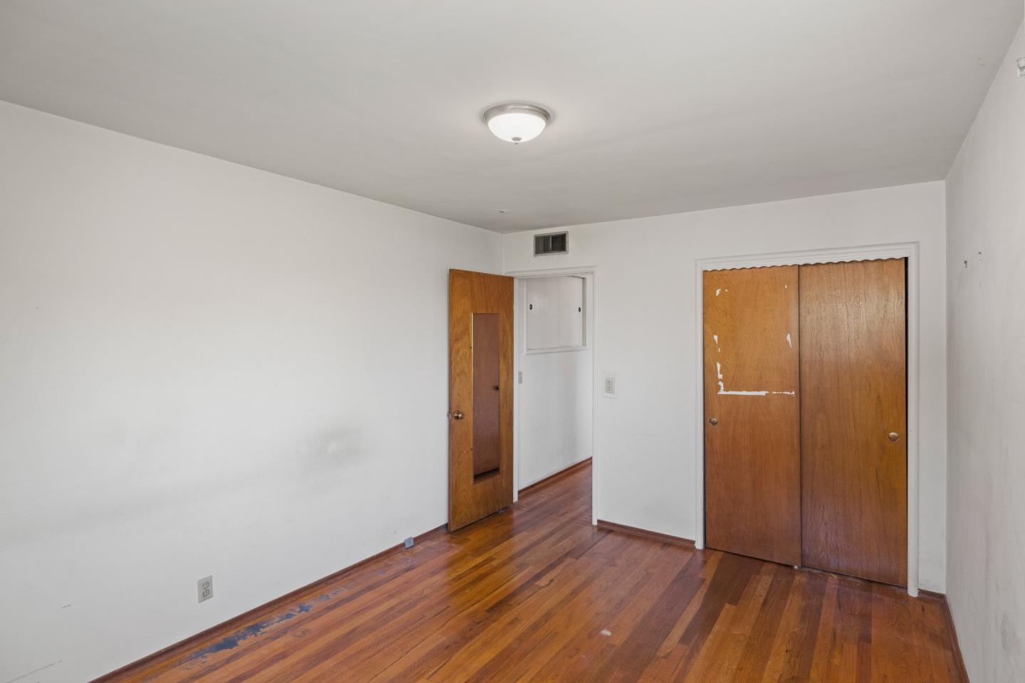 30 Acropolis Street Pacific Grove, CA 93950 - Photo 20 of 36 a view of an empty room and wooden floor