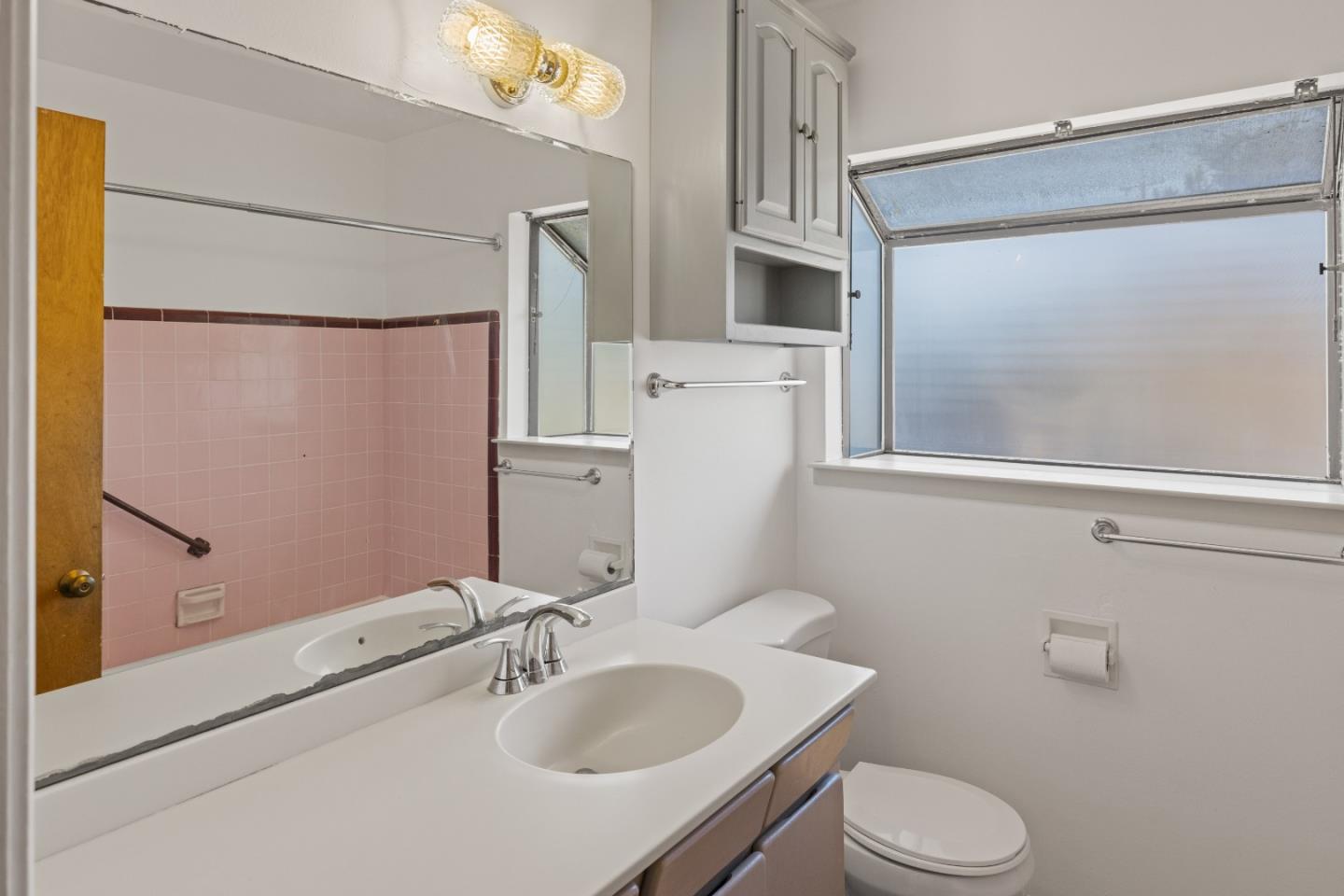 30 Acropolis Street Pacific Grove, CA 93950 - Photo 21 of 36 a bathroom with a sink toilet and shower