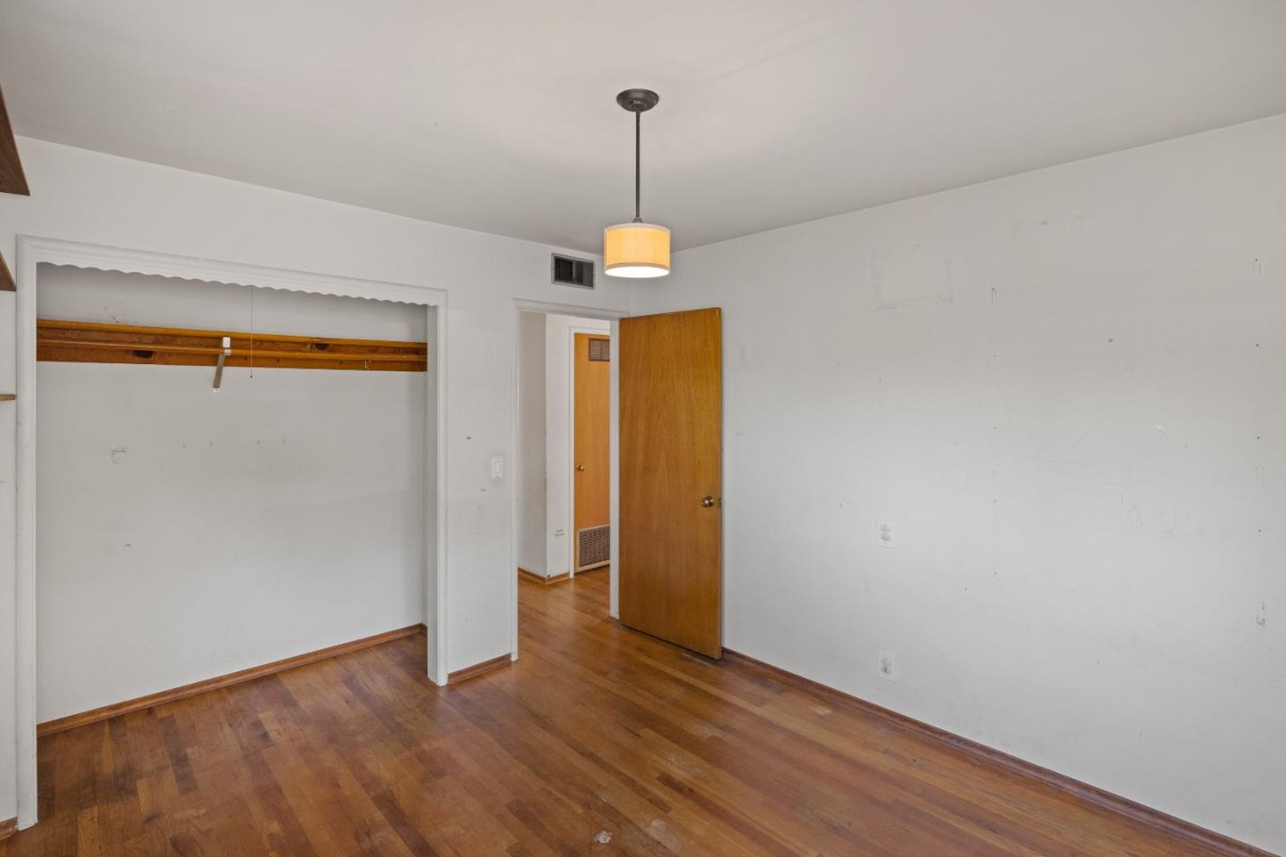 30 Acropolis Street Pacific Grove, CA 93950 - Photo 25 of 36 a room that has a mirror and wooden floor