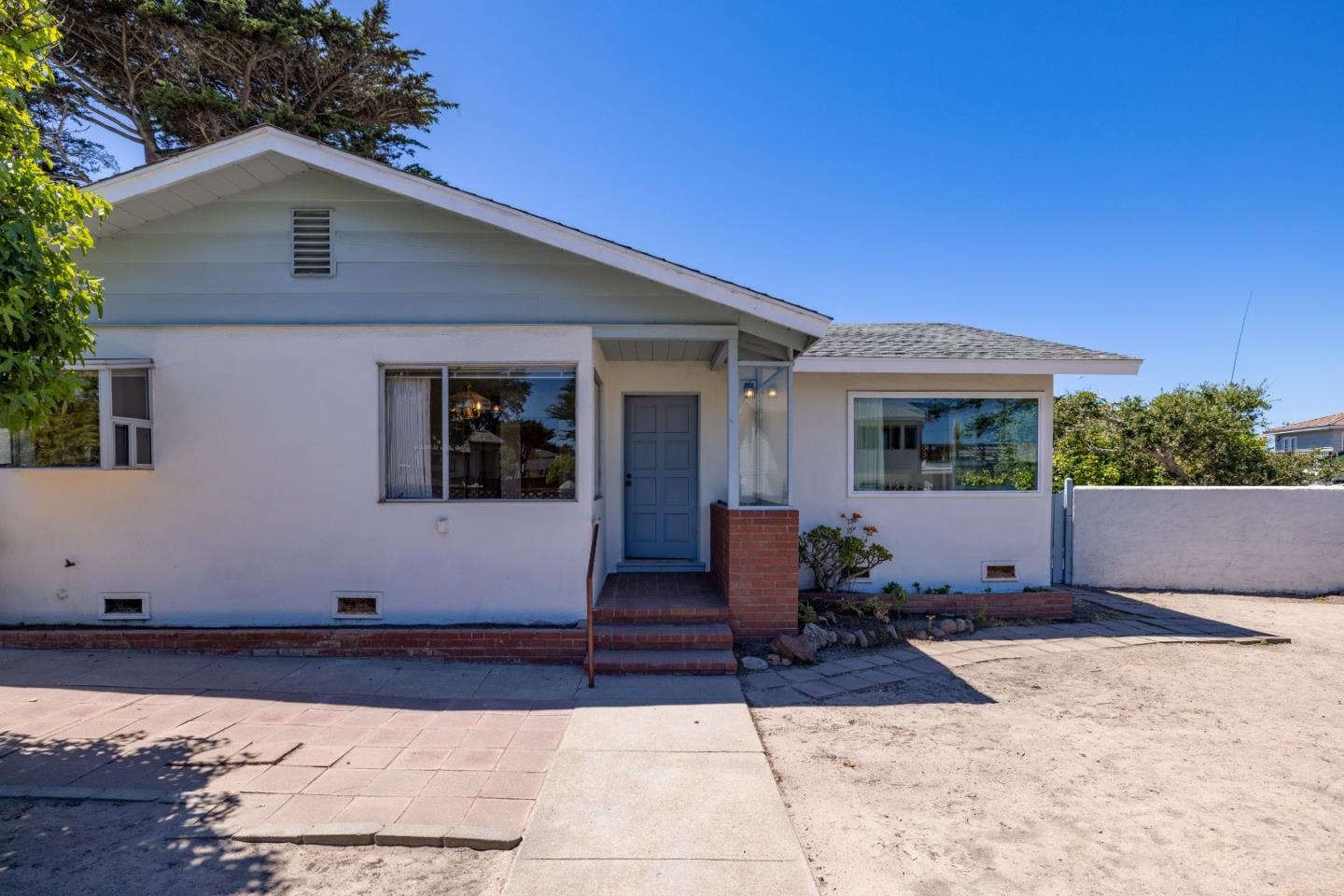 30 Acropolis Street Pacific Grove, CA 93950 - Photo 3 of 36 a front view of a house with a yard