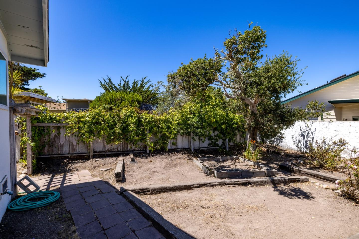 30 Acropolis Street Pacific Grove, CA 93950 - Photo 32 of 36 a view of a backyard with plants and outdoor seating