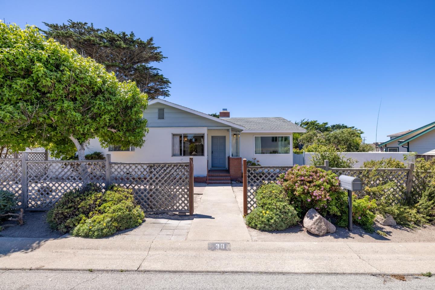 30 Acropolis Street Pacific Grove, CA 93950 - Photo 33 of 36 front view of a house with a yard