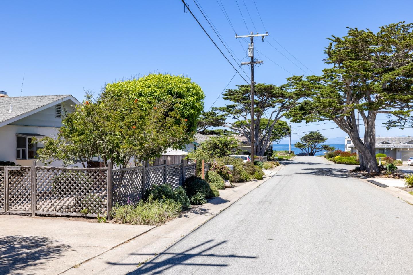 30 Acropolis Street Pacific Grove, CA 93950 - Photo 35 of 36 a backyard of a house with table and chairs plants