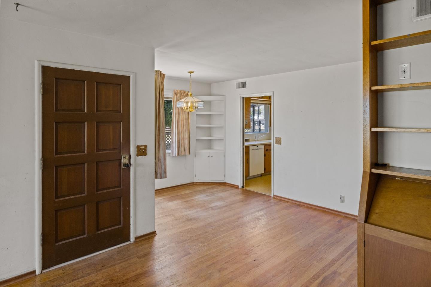 30 Acropolis Street Pacific Grove, CA 93950 - Photo 8 of 36 an empty room with wooden floor closet and windows