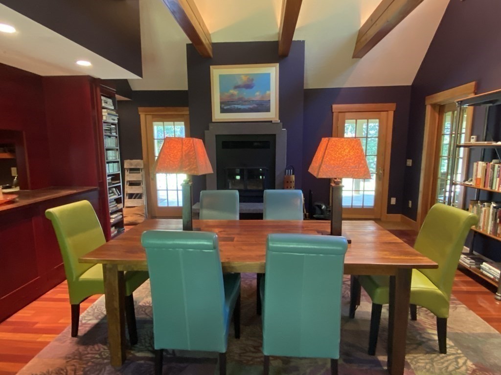 231 Turkey Hill Trail Rutland, MA 01543 - Photo 14 of 42 a dining room with furniture and a fireplace