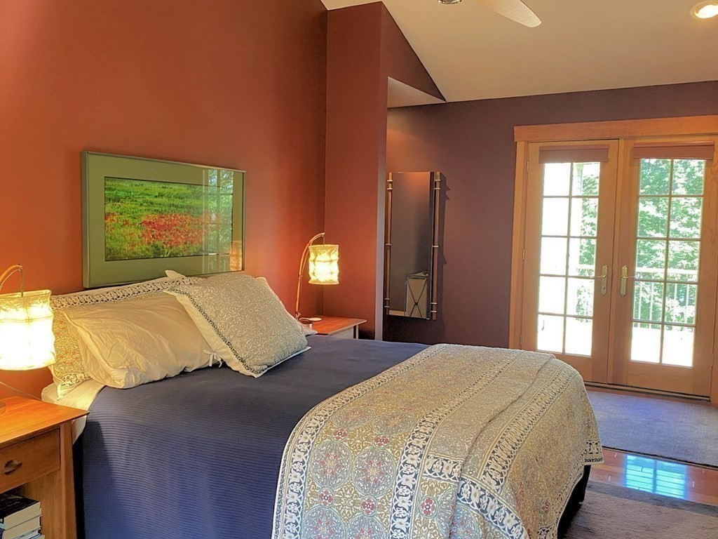 231 Turkey Hill Trail Rutland, MA 01543 - Photo 19 of 42 a bedroom with a large bed and a window