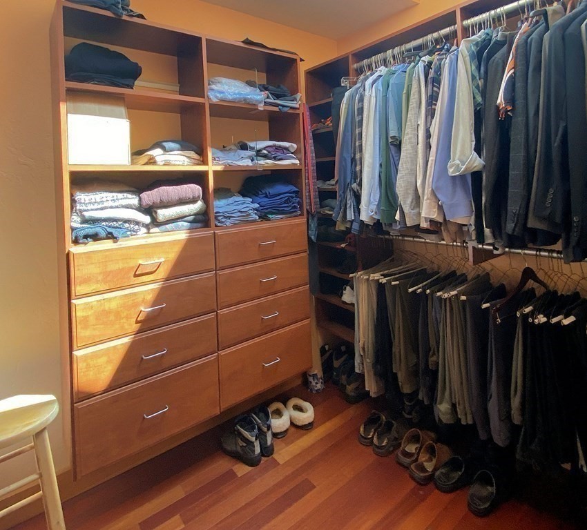 231 Turkey Hill Trail Rutland, MA 01543 - Photo 20 of 42 a view of walk in closet with clothes and shoes