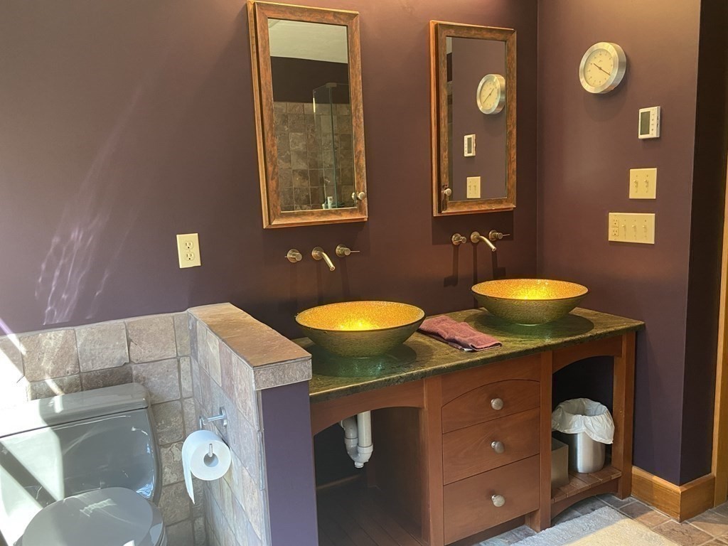 231 Turkey Hill Trail Rutland, MA 01543 - Photo 22 of 42 a bathroom with a sink and a mirror