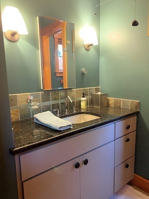 231 Turkey Hill Trail Rutland, MA 01543 - Photo 26 of 42 a bathroom with a granite countertop sink and a mirror