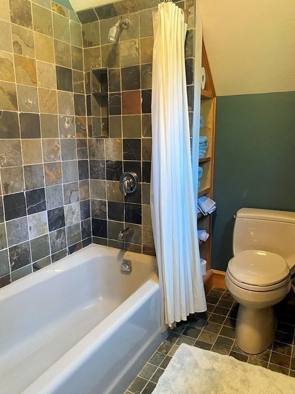 231 Turkey Hill Trail Rutland, MA 01543 - Photo 27 of 42 a bathroom with a toilet and a bathtub