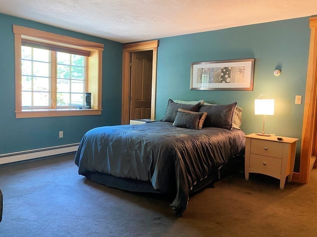 231 Turkey Hill Trail Rutland, MA 01543 - Photo 30 of 42 a bedroom with a bed and window