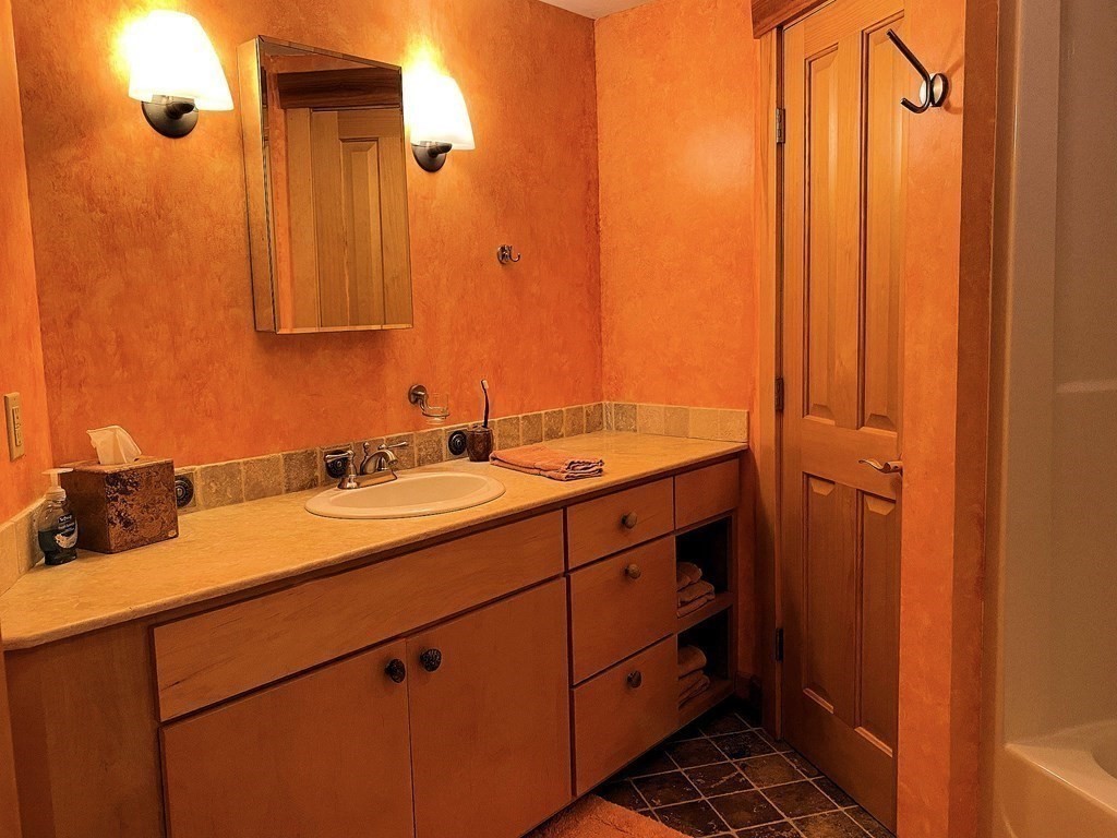 231 Turkey Hill Trail Rutland, MA 01543 - Photo 32 of 42 a bathroom with a double vanity sink and a mirror