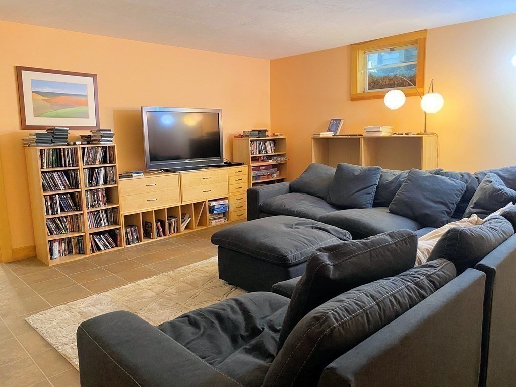 231 Turkey Hill Trail Rutland, MA 01543 - Photo 33 of 42 a living room with furniture and a flat screen tv