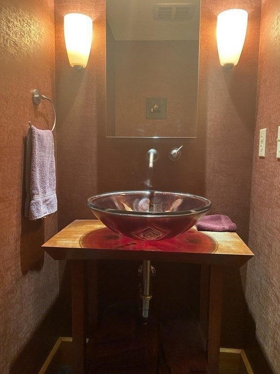 231 Turkey Hill Trail Rutland, MA 01543 - Photo 6 of 42 a bathroom with a sink and a mirror