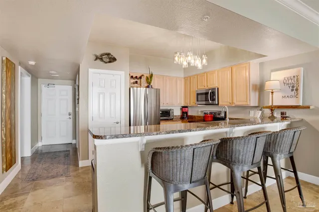 a bathroom with a sink toilet tub and shower
