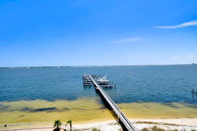 a view of a swimming pool with an outdoor seating